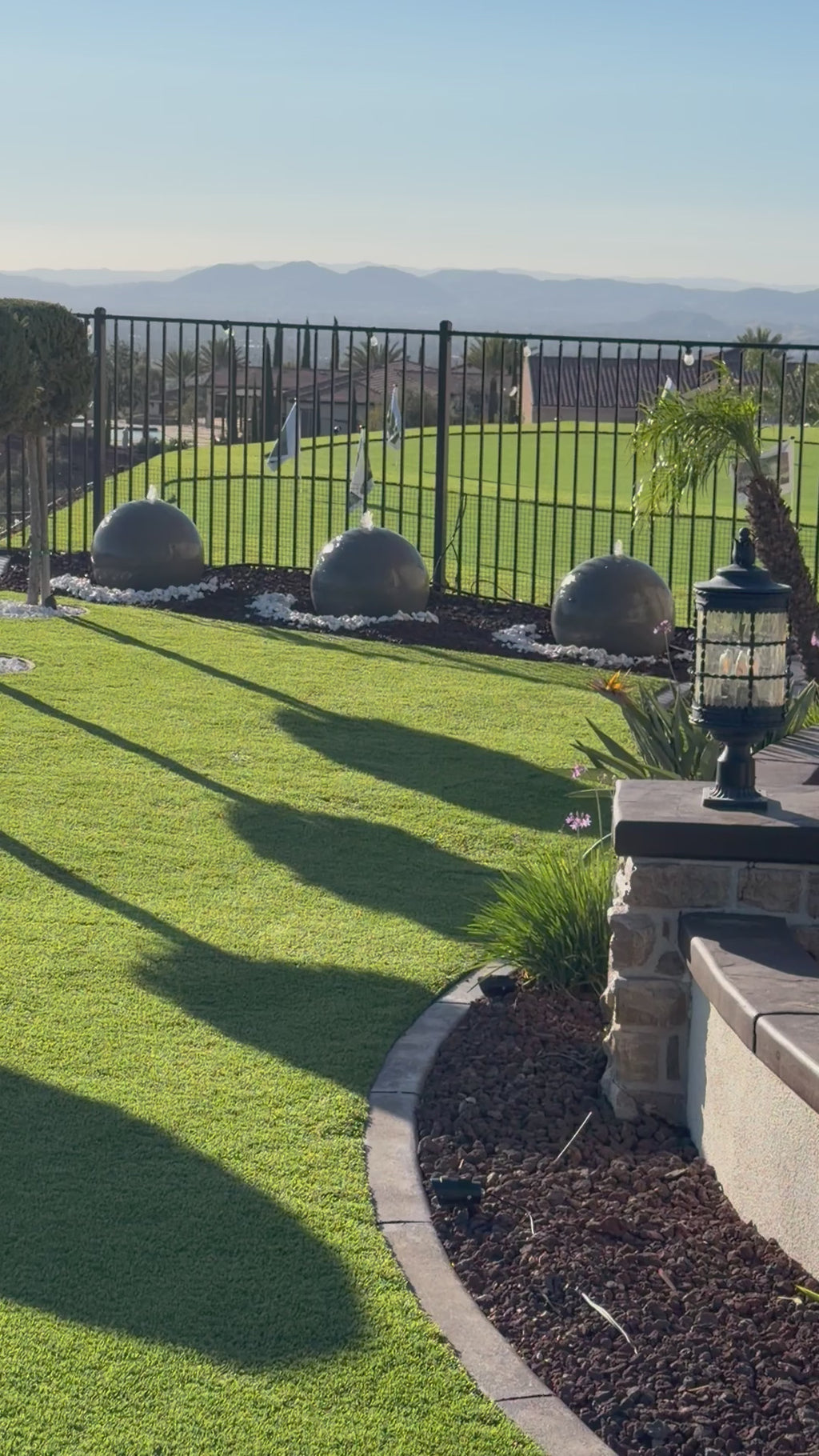 A set of (2)...24'' concrete spheres