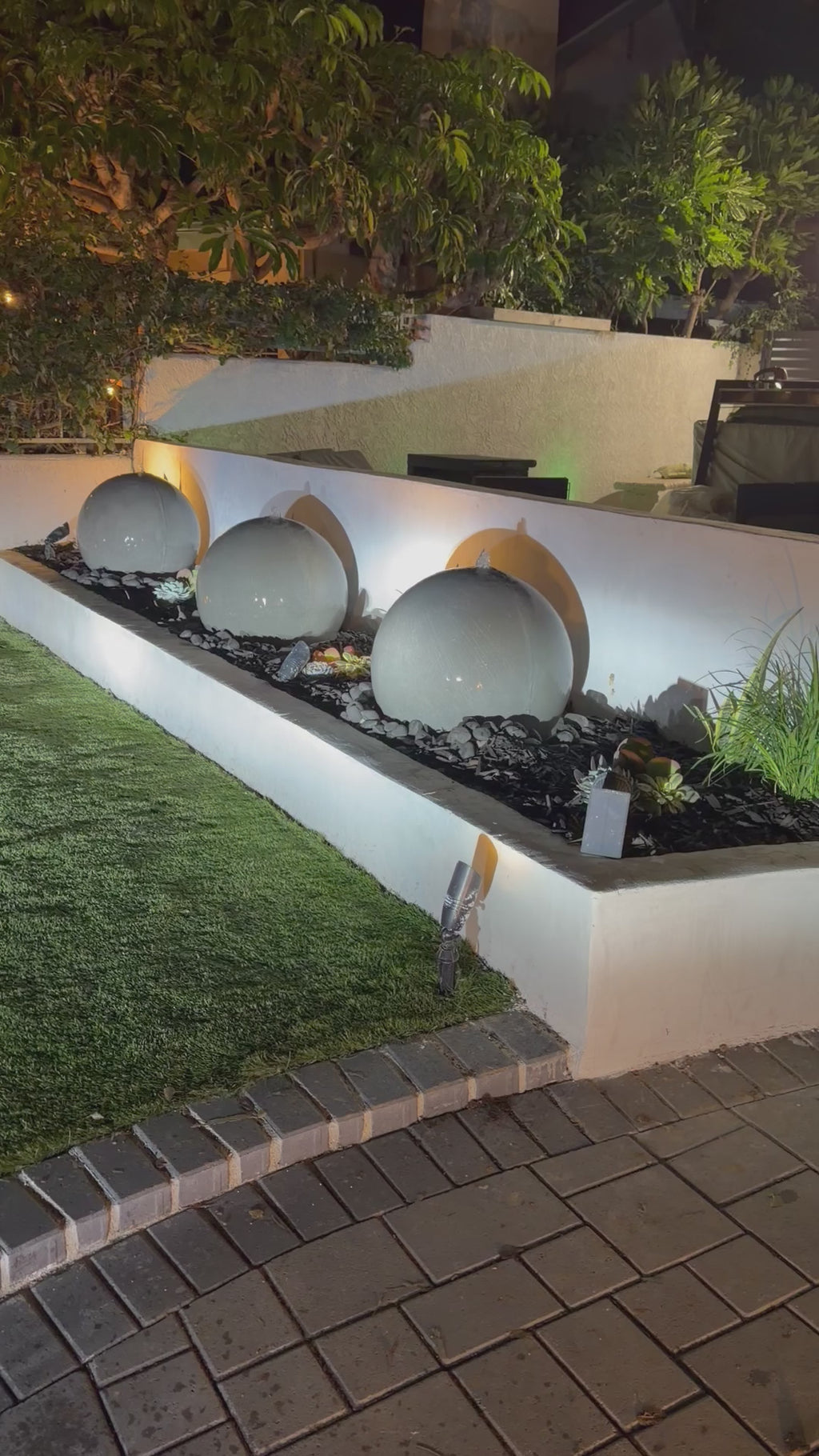 A set of (2)...24'' concrete spheres
