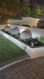 A set of (2)...24'' concrete spheres